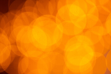 Blurred yellow-orange background. round bokeh patterns.
