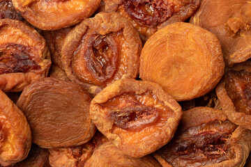 Dried peach fruit close up full frame as background