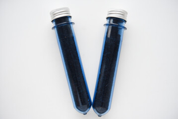 Two blue plastic flasks with a shiny lid. Flasks with tea inside.