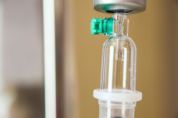 Close up medical intravenous IV drip in hospital background - 788529784