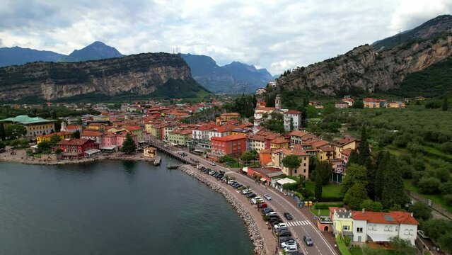 Scenic Garda lake , popular beautiful town and resort Torbole. aerial drone overflight 4k video. Trentino, Lago di Garda, Italy