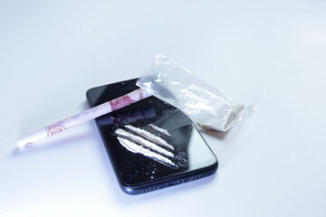 cocaine lines on a smartphone , white background