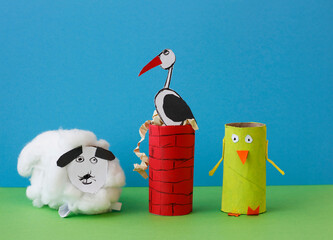 A sheep, a stork on a chimney and a chicken made by a child from a roll of toilet paper. Simple DIY...