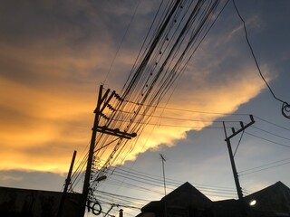 Electricity pole and power lines against and beautiful sky, sunset sky and wire