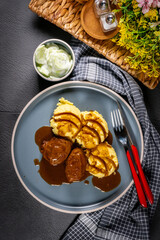 Traditional German braised pork cheeks in brown sauce. - 788556773