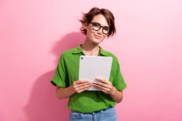 Photo portrait of attractive young woman hold tablet ereader wear trendy green clothes isolated on...