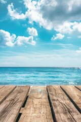 Obraz premium A wooden table with a scenic ocean view. Ideal for travel and vacation concepts