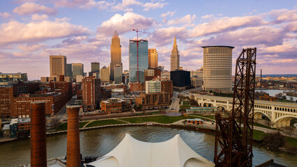Downtown Cleveland skyline at sunset with river in the foreground