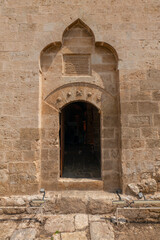Fototapeta na wymiar mardin nusaybin mor yakup church ruins next to the mosque church made of stone illuminated