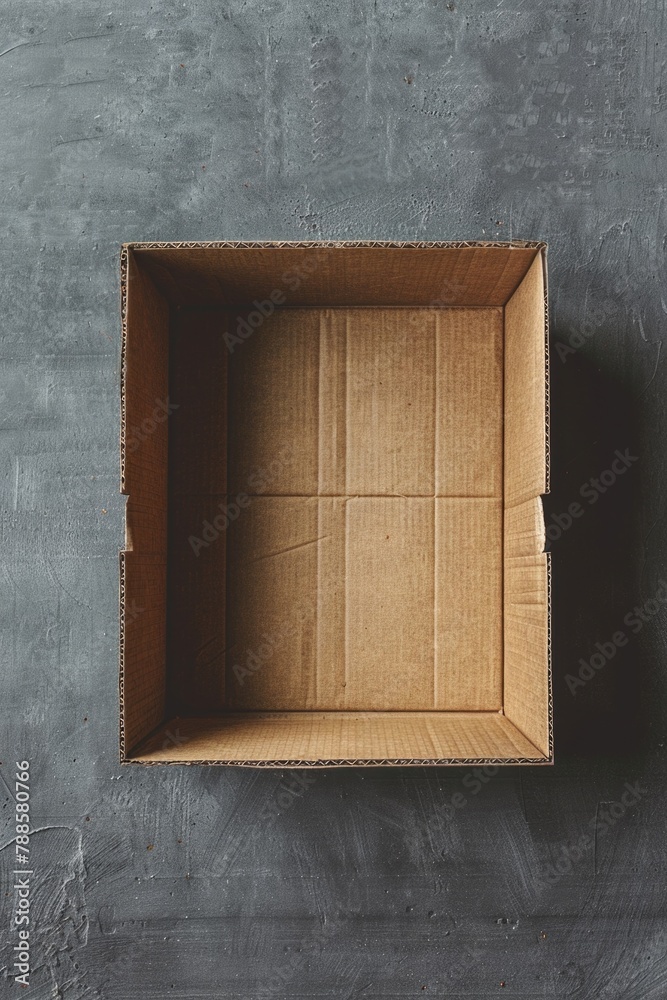 Aufkleber a cardboard box placed on a table, suitable for various concepts and designs