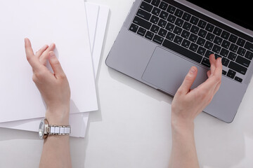 woman with a book, magazine and laptop on a white background. student. business. mockup