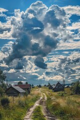 A dirt road leading to a small village. Suitable for travel brochures