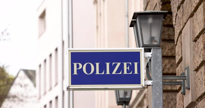 Police sign in German language in slow motion