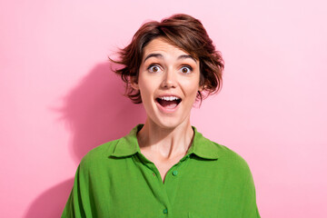 Photo of excited funky young woman dressed green shirt open mouth isolated pink color background
