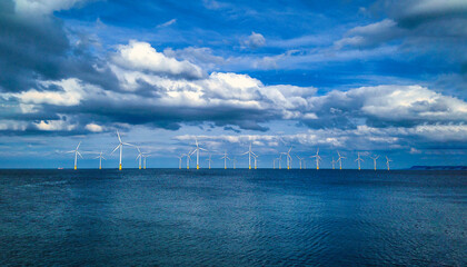 Offshore Wind Turbine in a Wind farm under construction off coast of England, UK