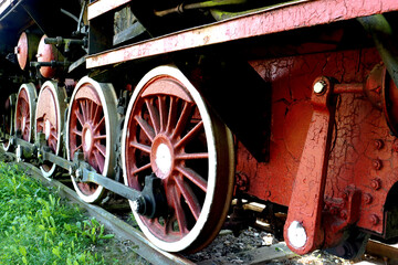 Retro steam locomotive wheels and rods.