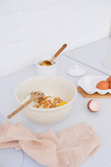 Home kitchen interiorBowl with dough, eggs and bowl of sugar on kitchen table in modern kitchen.