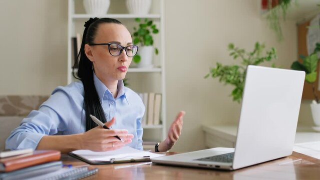 Woman psychologist mental therapist working remotely using computer for online therapy