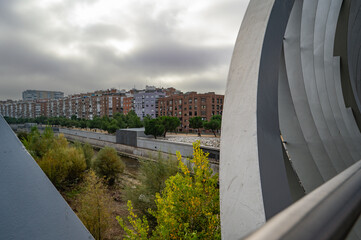 MADRID, SPAIN - November 17, 2023: Arganzuela Bridge in Madrid Rio Park, Designed by Dominique Perrault, it is 274 meters in length and formed by two spiral-shaped walkways . High quality photo