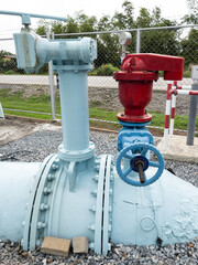 The large iron pipe with the control valve.