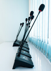 The modern microphone row for conference time.