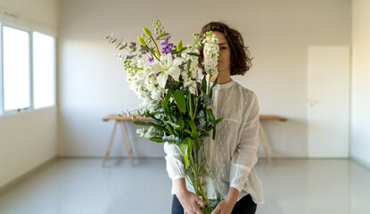 Florist arranging flowers in flower shop