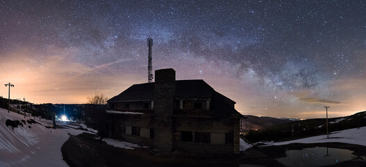 Old abandoned motel in Puerto de Piqueras between La Rioja and Soria on a cold starry night with...