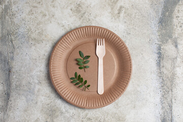 paper plate, fork and knife, top view,  Zero waste, plastic-free items. Stop plastic pollution. 