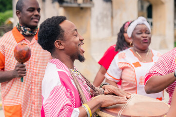 The Garífuna company performs traditional songs with drums and dances in the African-American men...