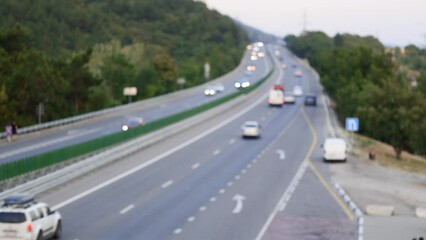 Experience dynamic flow of vehicles on contemporary high-speed expressway. Witness speed and efficiency of modern transportation infrastructure. Footage for automotive enthusiasts and travel vlogs