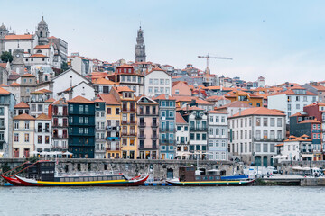 Porto, Skyline view of the old town of Portugal on the Douro river. Travel and monuments of Portugal. Old historic houses of Porto. Rows of colorful buildings in traditional architectural style. - 788629196