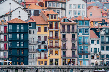 Porto, Skyline view of the old town of Portugal on the Douro river. Travel and monuments of Portugal. Old historic houses of Porto. Rows of colorful buildings in traditional architectural style. - 788629315