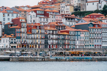 Porto, Skyline view of the old town of Portugal on the Douro river. Travel and monuments of Portugal. Old historic houses of Porto. Rows of colorful buildings in traditional architectural style. - 788629323