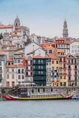 Porto, Skyline view of the old town of Portugal on the Douro river. Travel and monuments of Portugal. Old historic houses of Porto. Rows of colorful buildings in traditional architectural style. - 788629581