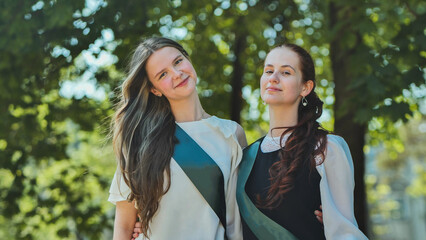 Portrait of two Russian schoolgirls graduating from high school.