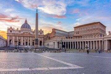 St. Peter's basilica and Apostolic palace on St. Peter's square in Vatican at sunset, center of...