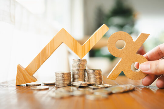 Percentage model and down arrow with coin stack. Key concepts for success, methods, systems of raising or lowering Fed interest rates to correct inflation concepts.