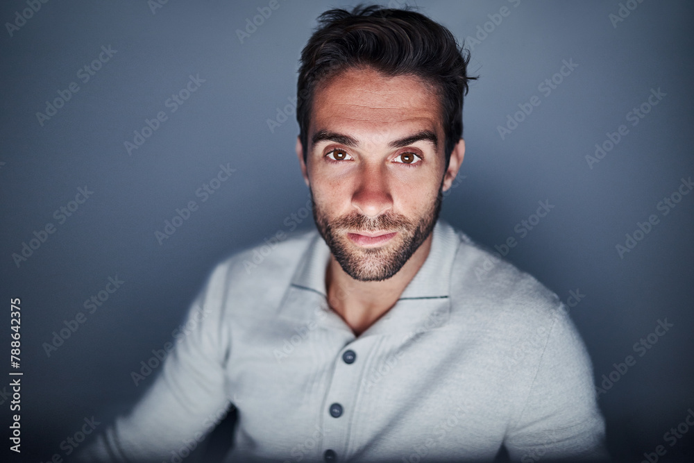 Poster Portrait, man and night on computer with website developing in studio on grey background with deadline. Employee, confident and startup business with ambition for career growth as web designer