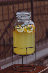 Non-alcoholic cocktail. Cool lemon drink. Lemonade in a jar. Street cafe. Quench your thirst. Summer drink. Glass jar with cold lemonade. 