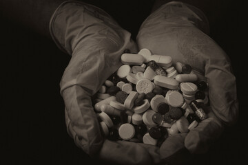 Latex gloves, doctor, doctor's hands, pills in palms, handful of pills, many pills, treatment,...