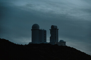 Silhouette of an astronomical observatory building located high in the mountains on the Canary...