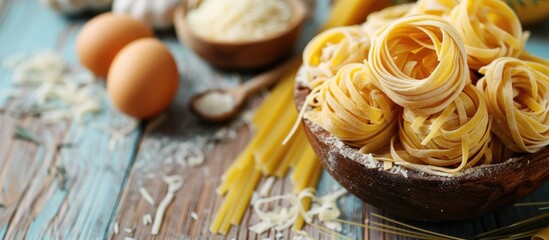 Homemade pasta and pasta ingredients displayed on a wooden background