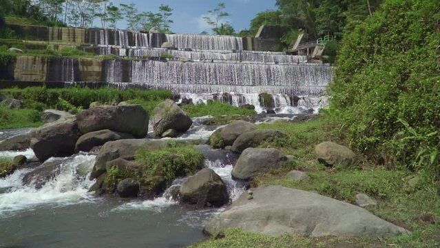 large sabo dam with a six-level dam and is now fed by clear river water from the foot of the mountain. Sabo Dam functions to stem the flow of cold lava when the volcano erupts