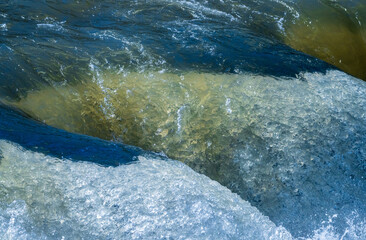 Frozen motion view of raging water flowing over rocks of Valley Falls State Park on Tygart River near Fairmont West Virginia