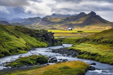 a river running through a valley with mountains in the background