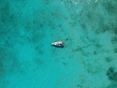 Aerial view of beautiful Junkanoo Beach with sailboat, Nassau, New Providence, The Bahamas.