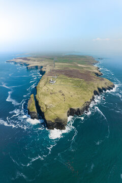Aerial view of beautiful seaside cliff with Aill na Brun Lighthouse, Kilballyowen, Clare, Ireland.