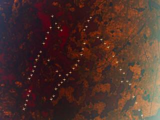 Aerial view of colorful chili pepper fields being harvested by women under the sun, Celestun, Yucatan, Mexico.