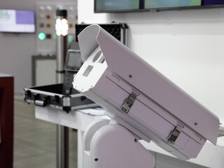 Portable CCTV security camera on case and security room background