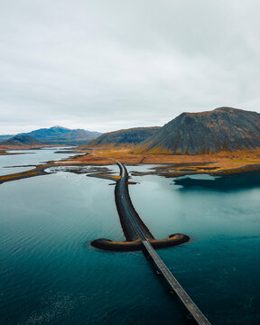 Aerial drone view of Viking Bridge, sword shaped bridge on the Snaefellsnes Peninsula, West Iceland.
